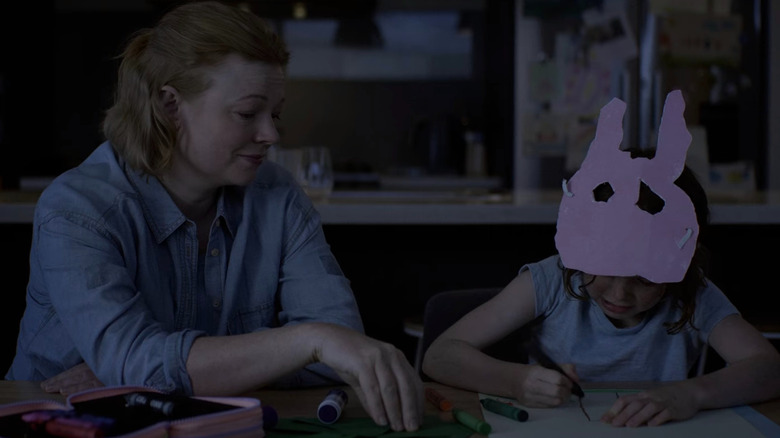 Sarah watches as Mia draws
