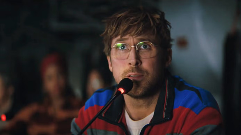 Ryland speaking into a microphone in Project Hail Mary