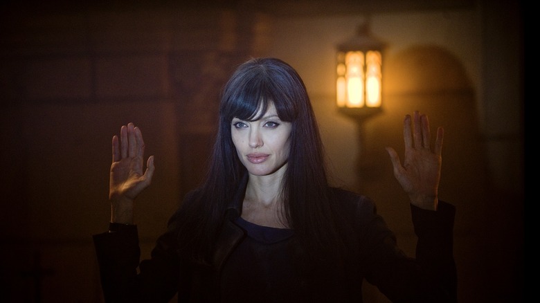 Evelyn Salt raising her hands