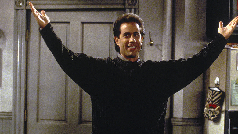 Seinfeld arms outstretched