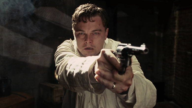 Teddy panicking holding a gun