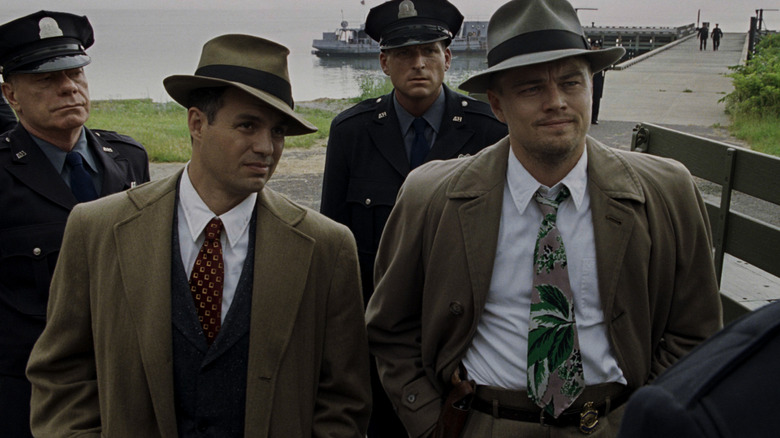 Chuck and Teddy standing with the police