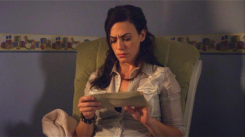 Tara looking at letters