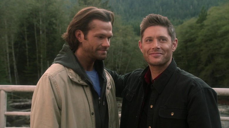 Dean with his arm around Sam