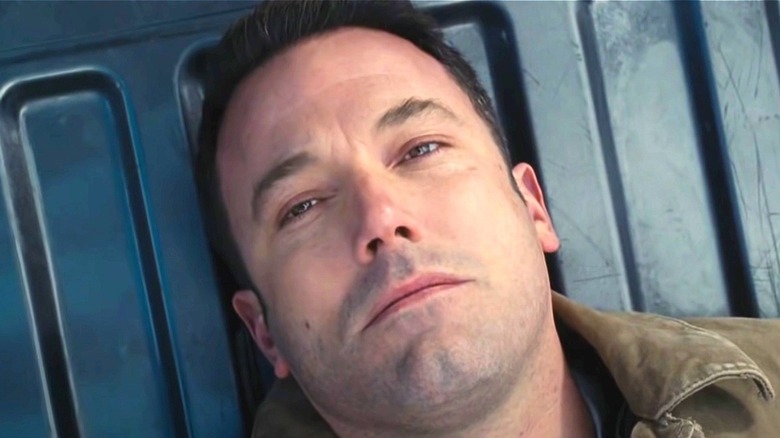 Christian Wolff lying down in The Accountant