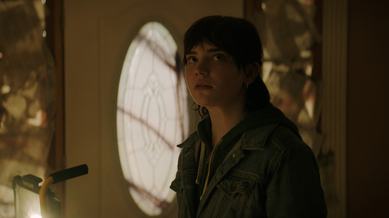 Sophie Thatcher looks up