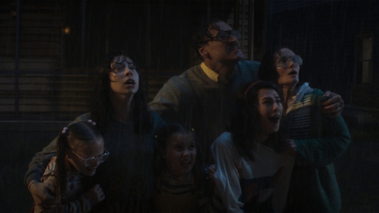 Carin, Heather, Shannon, Jack Smurl, Dawn, and Janet Smurl huddled together
