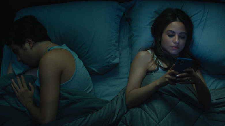 Nat Wolff asleep near bored Aimee Carrero 