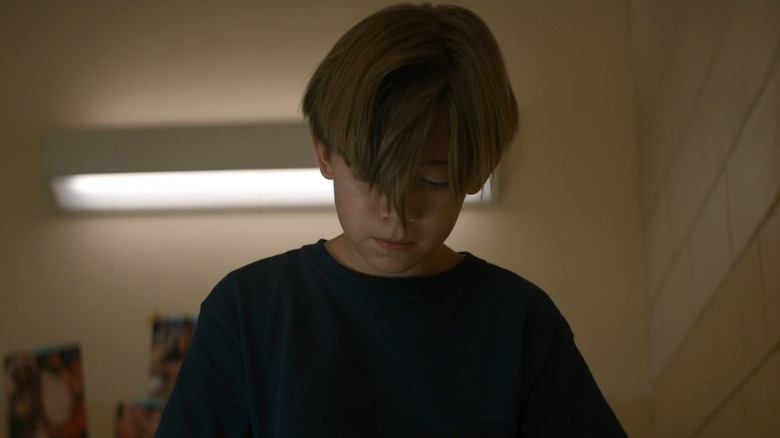 Sad boy looking down