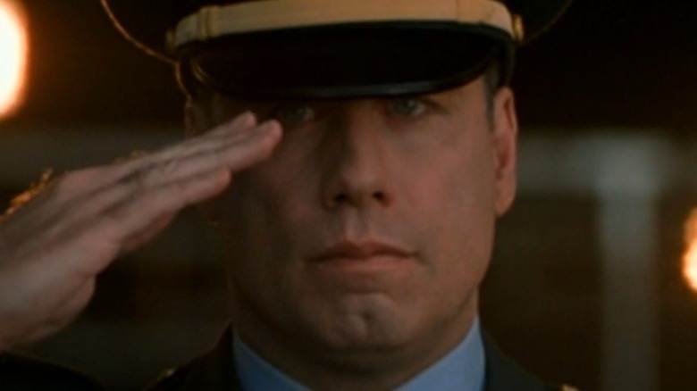 John Travolta in uniform saluting