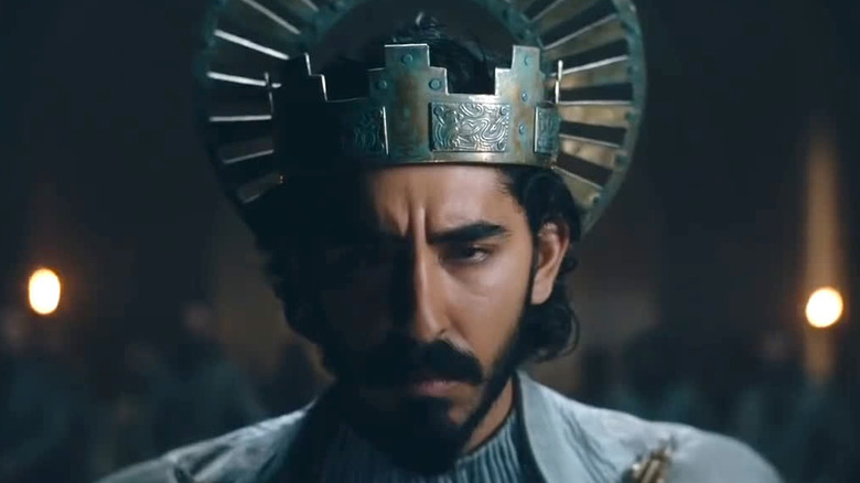 Dev Patel as Gawain wearing crown in The Green Knight