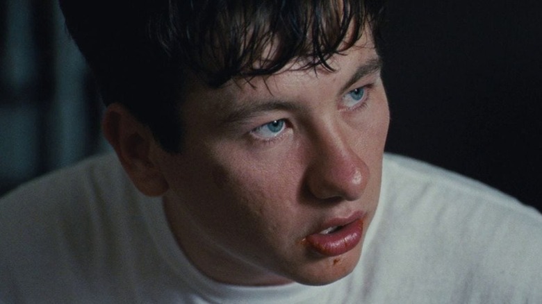 Martin Lang looks up at Steven Murphy and speaks