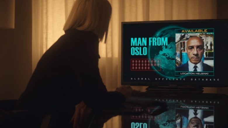 The Handler looks up the Man from Oslo on computer