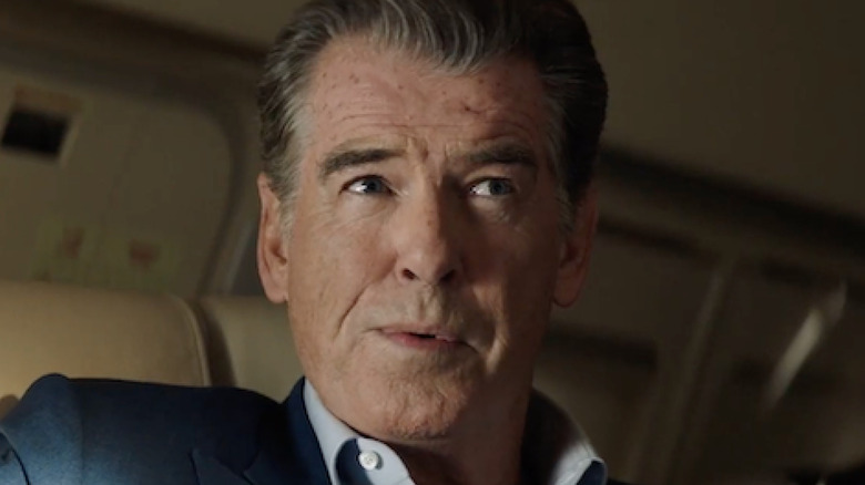 Pierce Brosnan smirking