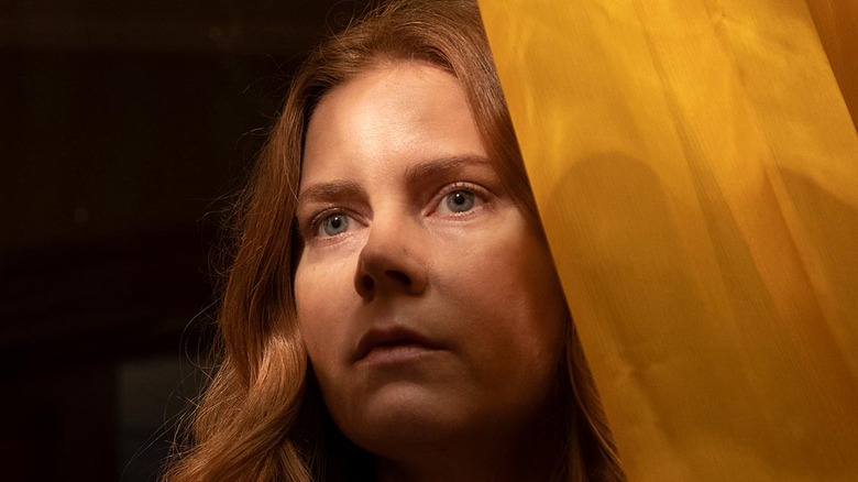 Amy Adams behind yellow curtain