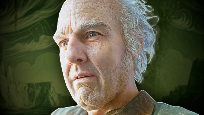 Digger with an exasperated expression in front of green background