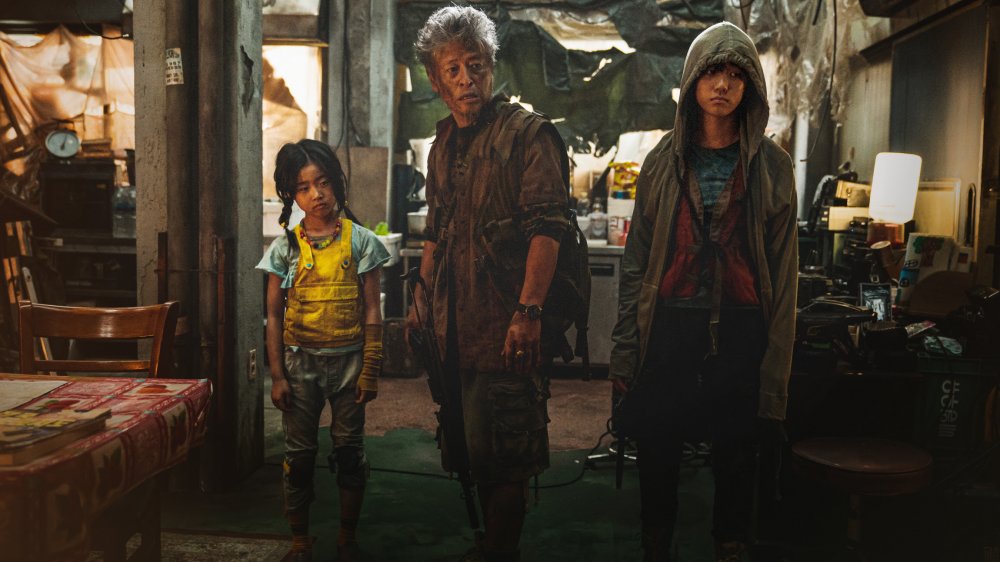 Kwon Hae-hyo as Old Man Kim with his daughters in Train to Busan Presents: Peninsula