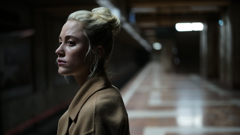 Julia standing on subway platform