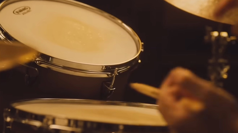 Andrew plays drums
