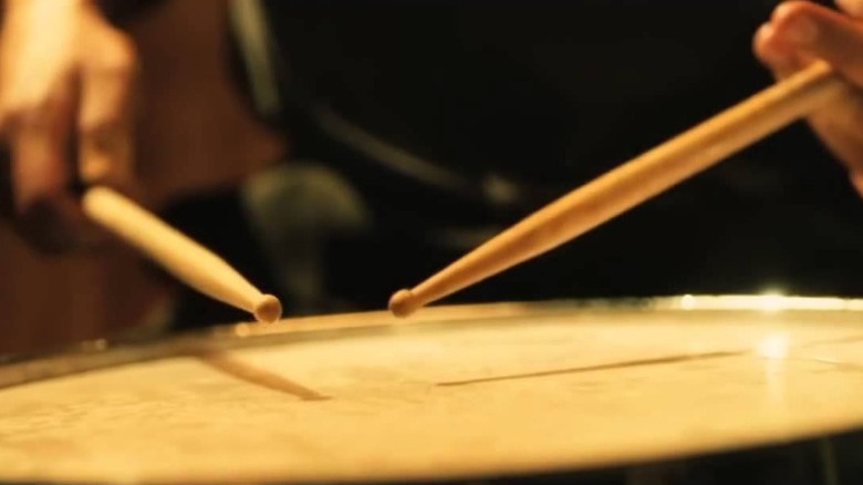 close up of hands playing drumroll