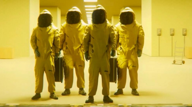Async scientists wearing hazmat suits