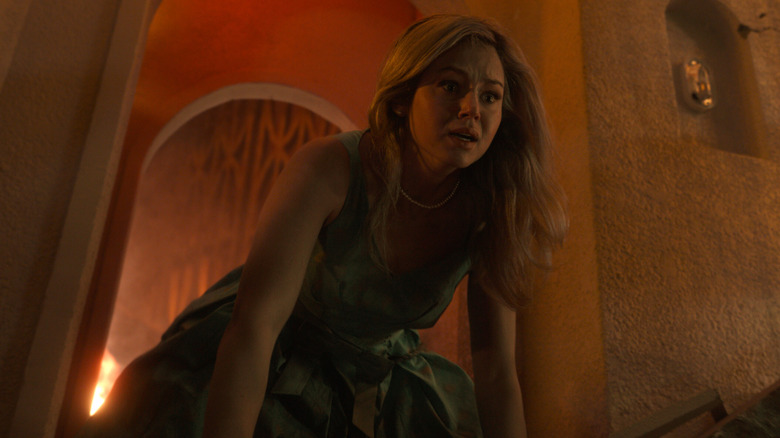 Iris looks over the edge of the dance floor in horror in "Final Destination Bloodlines" (2025)