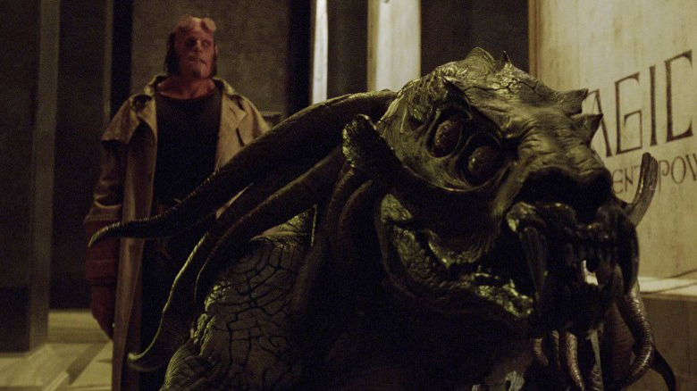 Hellboy standing behind Sammael