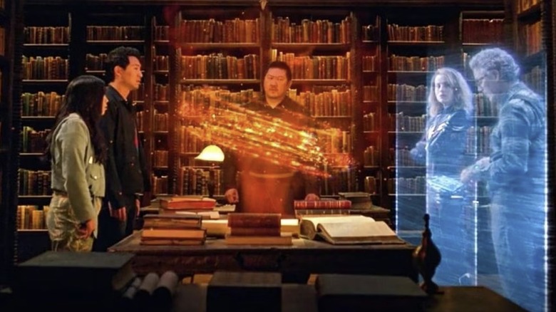 Katy and Shang-Chi confer with Wong, Captain Marvel, and Bruce Banner in "Shang-Chi and the Legend of the Ten Rings" (2021)