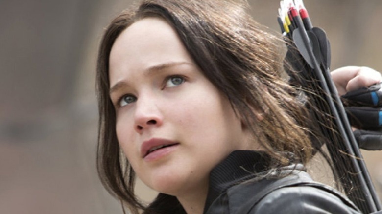 Katniss Everdeen draws an arrow
