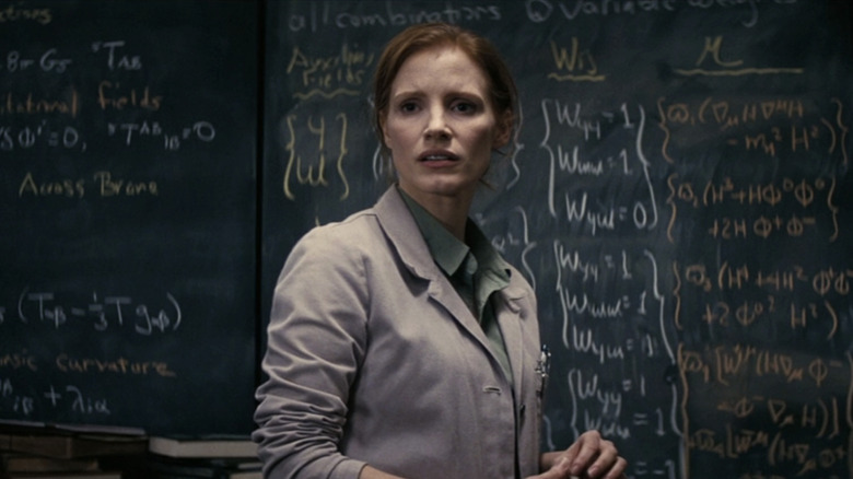 Murph standing in front of equations