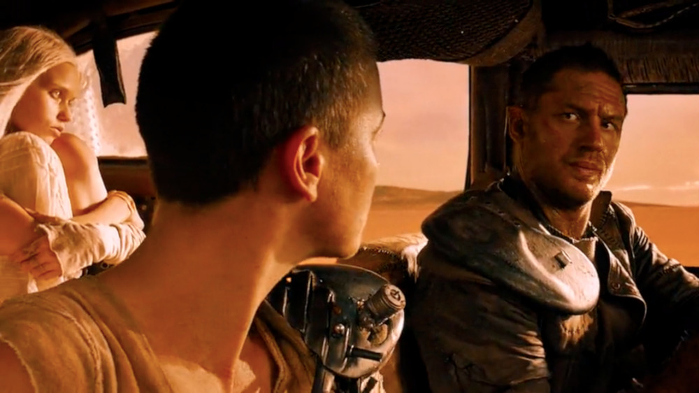 Abbey Lee, Charlize Theron, and Tom Hardy in Mad Max: Fury Road