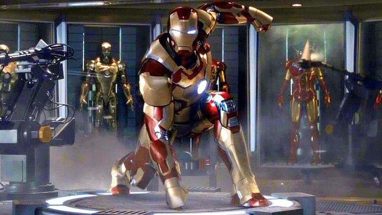 Various Iron Man suits in Tony Stark's workshop in "Iron Man 3" (2013)