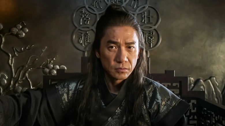 Ancient Wenwu sits on an ornate chair in "Shang-Chi and the Legend of the Ten Rings" (2021)