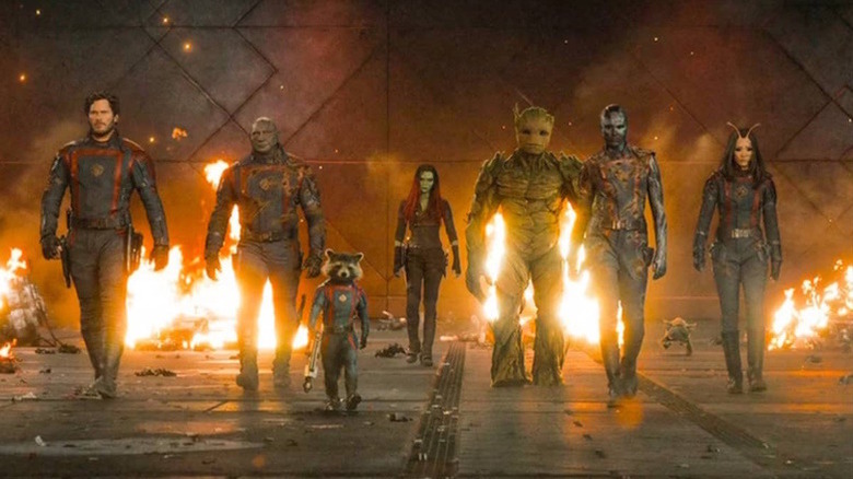 Guardians of the Galaxy walking with flames behind them in "Guardians of the Galaxy Vol. 3" (2023)