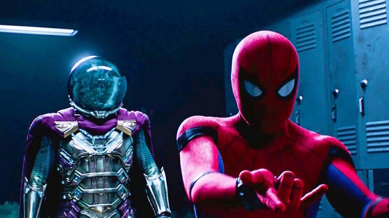 Spider-Man makes web-shooting motion as Mysterio stands behind him in "Spider-Man: Far from Home" (2019)