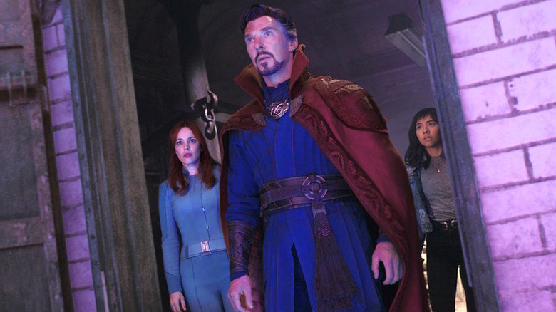 Doctor Strange, America, and Christine bathed in purple light in "Doctor Strange in the Multiverse of Madness" (2022)