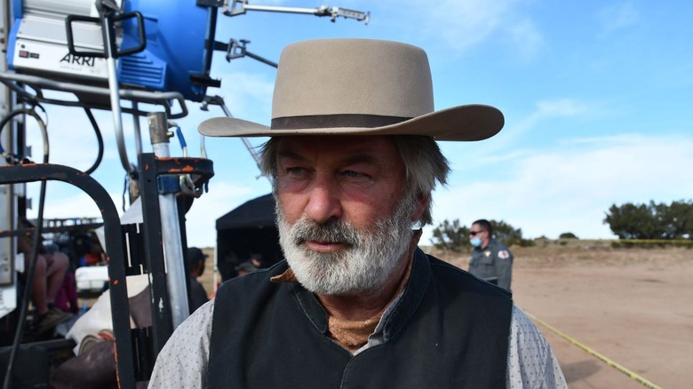 Alec Baldwin in cowboy hat on film set