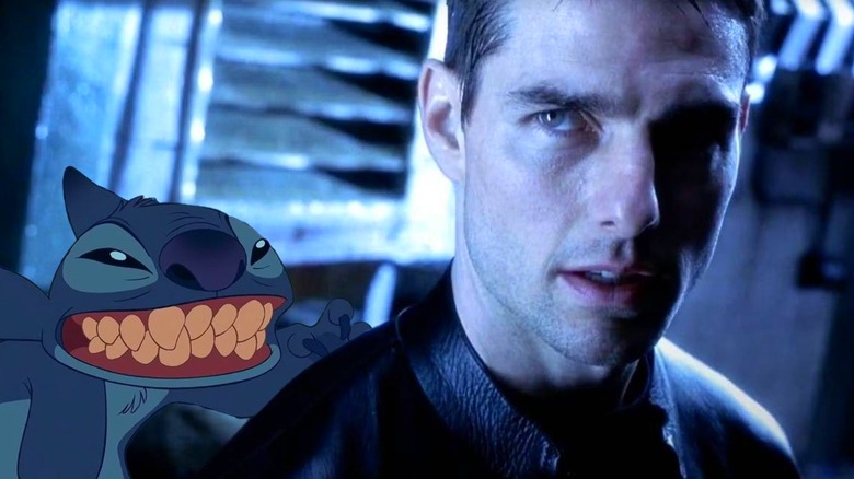 Stitch sneaking up behind John Anderton in a blue room in Minority Report (2002)