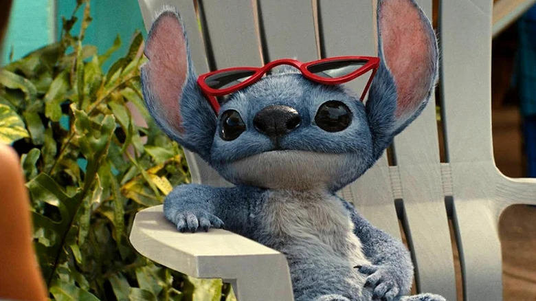 Stitch sitting on a chair in 2025's Lilo & Stitch