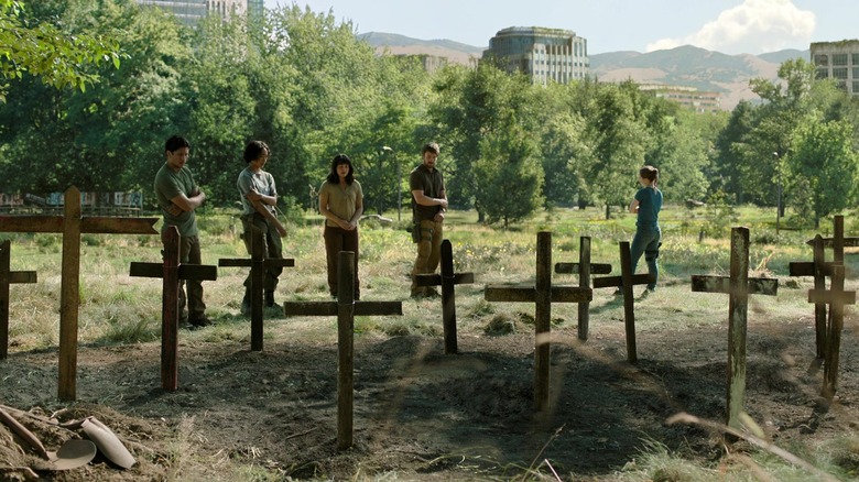 Abby and her friends standing by graves