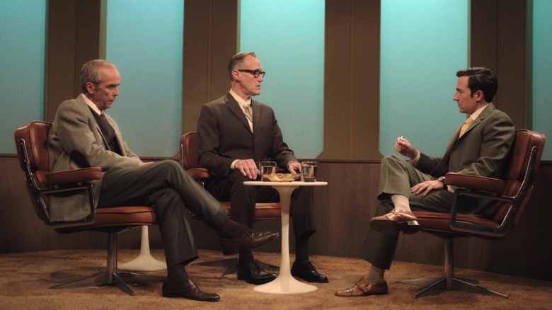 Three men having conversation on talk show