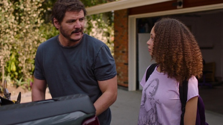 Joel and Sarah standing in a driveway