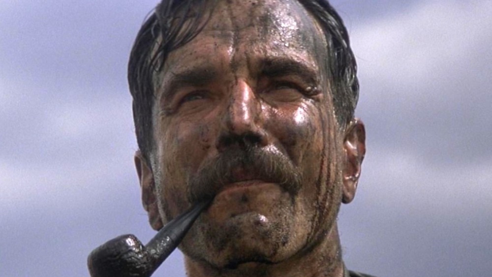 Daniel Plainview smoking a pipe