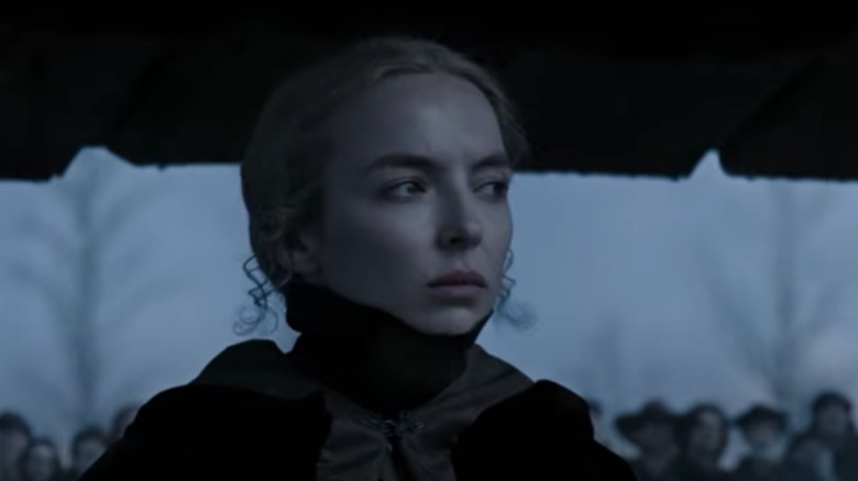 Jodie Comer in The Last Duel with black high collar attire