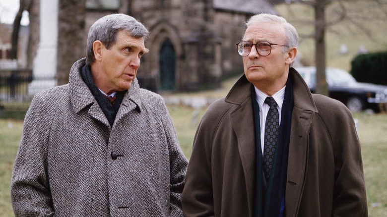 Control and Robert walking outside together in The Equalizer (1989)