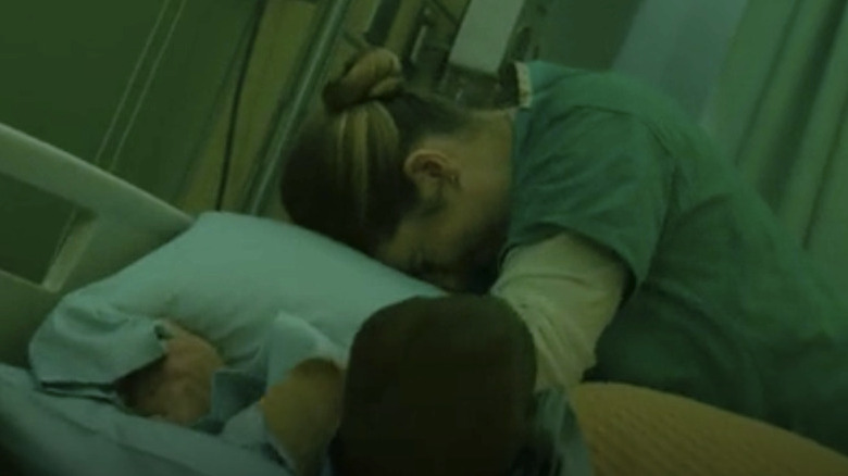 Nurse Bloch suffocating Harlan with a pillow