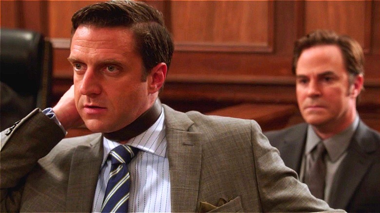 Barba with a belt around his neck