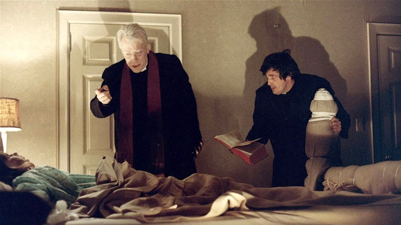 Father Lankester Merrin and Father Damien Karras giving Raegan an exorcism
