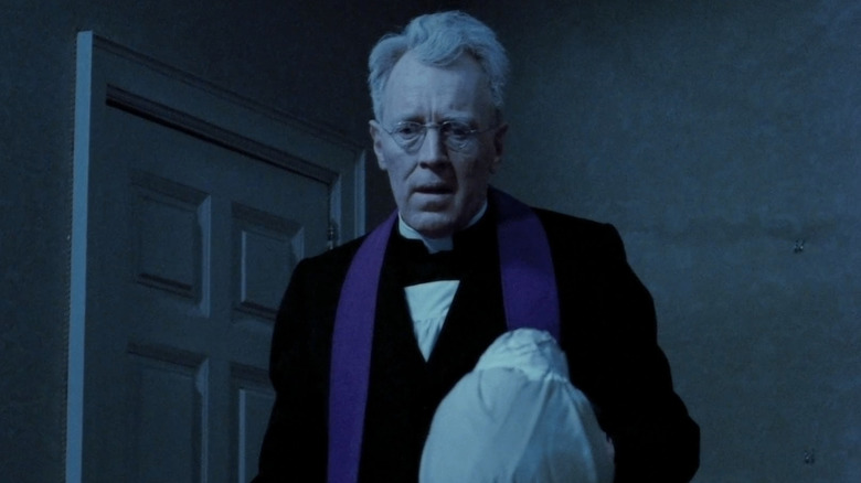 Lankester Merrin performing exorcism