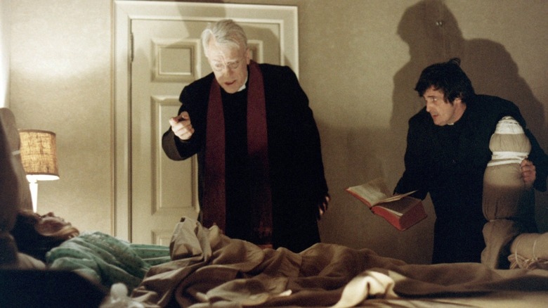 Father Merrin and Father Karras perform an exorcism on Regan in "The Exorcist" (1973)